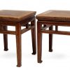 Square stools with vertical supports and horse hoof feet